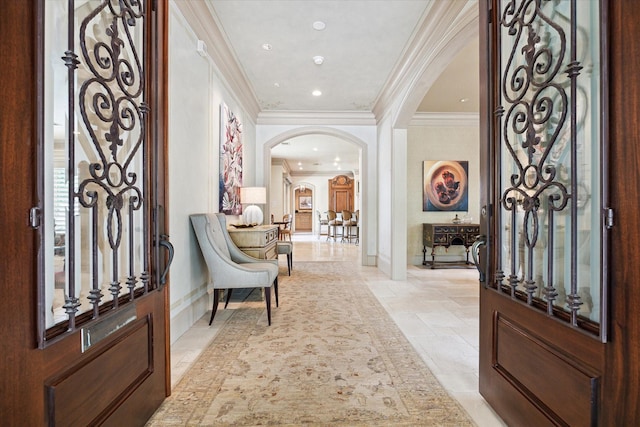 3019 Sunset Blvd, Houston, TX 77005 - foyer entrance with arched walkways, crown molding, stone tile floors, baseboards, and recessed lighting