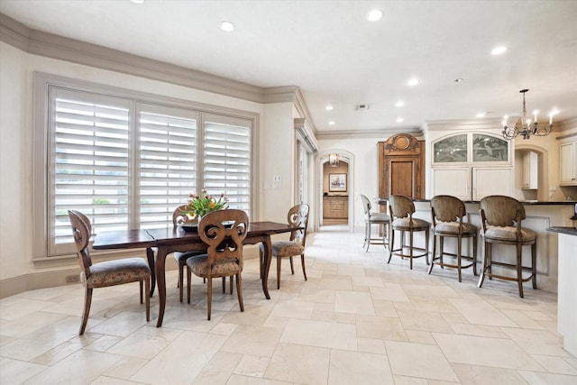 3019 Sunset Blvd, Houston, TX 77005 - dining room with a chandelier, recessed lighting, arched walkways, crown molding, and baseboards
