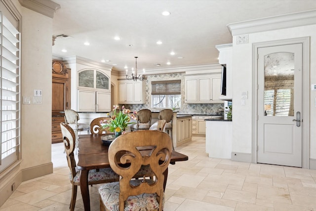 3019 Sunset Blvd, Houston, TX 77005 - dining area featuring a chandelier, ornamental molding, baseboards, recessed lighting, and stone tile floors