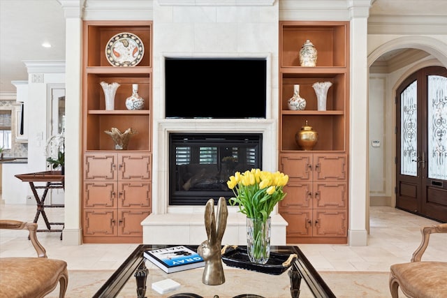 3019 Sunset Blvd, Houston, TX 77005 - living area featuring ornamental molding, built in shelves, arched walkways, and baseboards