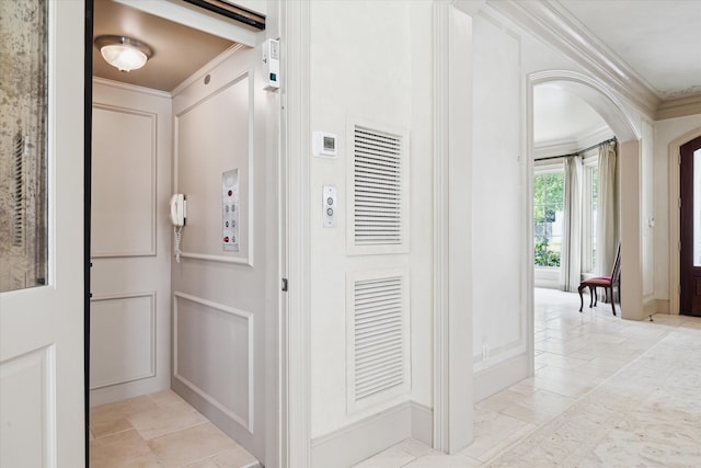 3019 Sunset Blvd, Houston, TX 77005 - hallway with crown molding, elevator, baseboards, and arched walkways