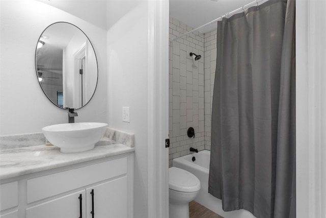 4220 Kenbrook Dr, Nacogdoches, TX 75965 - bathroom with vanity, shower / bathtub combination with curtain, toilet, and wood finished floors
