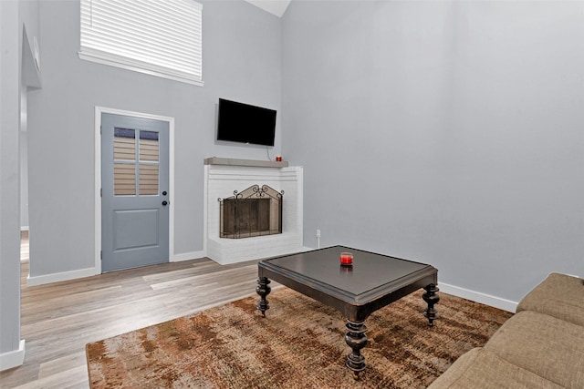 4220 Kenbrook Dr, Nacogdoches, TX 75965 - living area featuring baseboards, light wood-style flooring, and a high ceiling