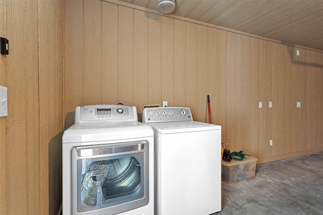 4220 Kenbrook Dr, Nacogdoches, TX 75965 - laundry area featuring washer and dryer and wooden walls