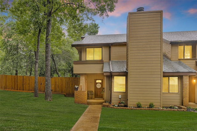 4220 Kenbrook Dr, Nacogdoches, TX 75965 - view of front of home with a chimney, a shingled roof, and brick siding