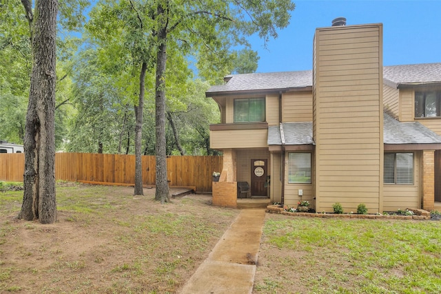4220 Kenbrook Dr, Nacogdoches, TX 75965 - view of front of property featuring a chimney and roof with shingles