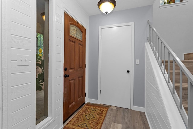4220 Kenbrook Dr, Nacogdoches, TX 75965 - entryway with wood finished floors, stairway, and baseboards