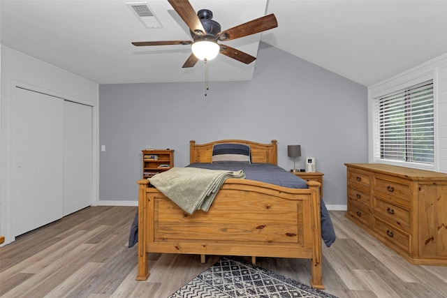 4220 Kenbrook Dr, Nacogdoches, TX 75965 - bedroom featuring light wood-style floors, a closet, ceiling fan, baseboards, and lofted ceiling