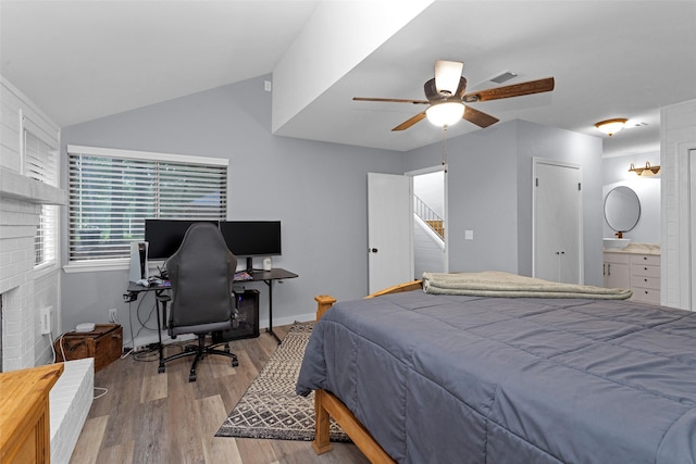 4220 Kenbrook Dr, Nacogdoches, TX 75965 - bedroom with wood finished floors, vaulted ceiling, baseboards, a ceiling fan, and a desk