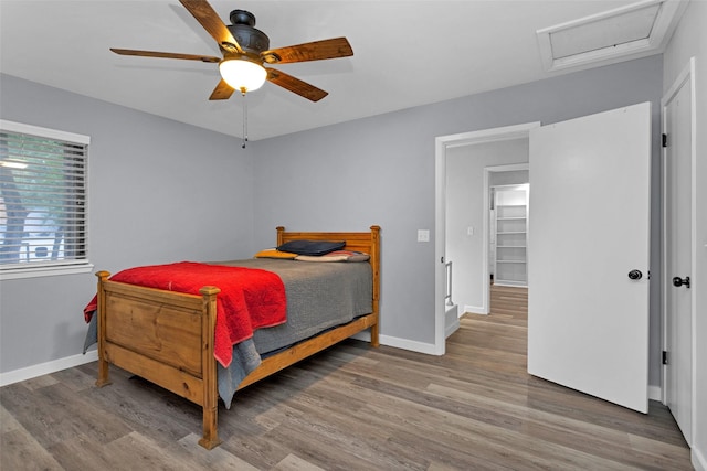 4220 Kenbrook Dr, Nacogdoches, TX 75965 - bedroom with attic access, wood finished floors, baseboards, and a ceiling fan