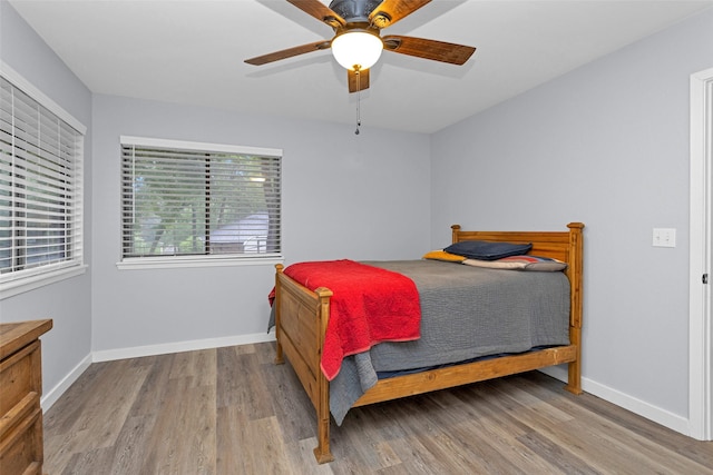 4220 Kenbrook Dr, Nacogdoches, TX 75965 - bedroom with wood finished floors, baseboards, and a ceiling fan