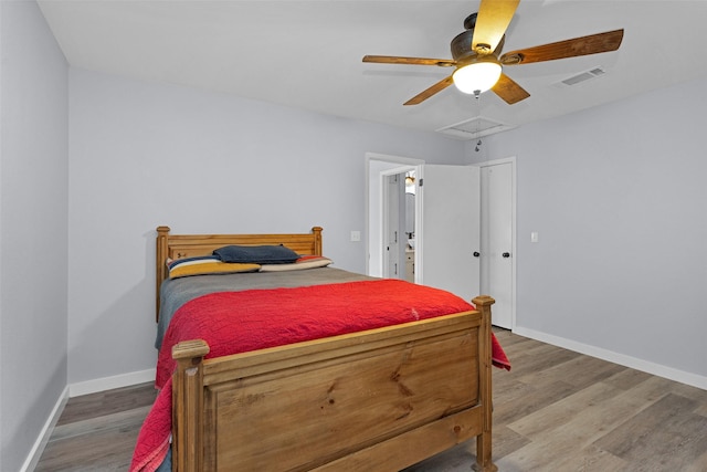 4220 Kenbrook Dr, Nacogdoches, TX 75965 - bedroom featuring baseboards, wood finished floors, attic access, and ceiling fan