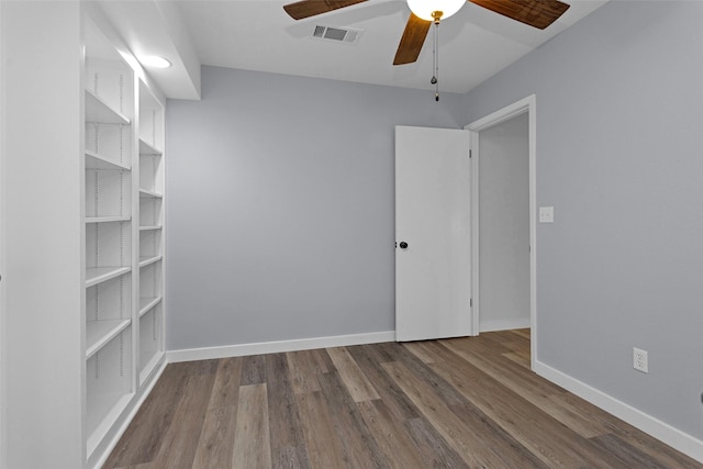 4220 Kenbrook Dr, Nacogdoches, TX 75965 - empty room featuring a ceiling fan, wood finished floors, and baseboards