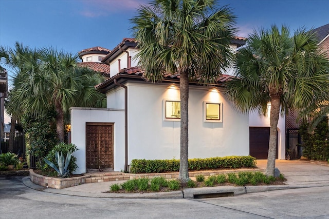 721 Harborside Way, League City, TX 77565 - view of front facade featuring stucco siding, concrete driveway, a garage, and a tiled roof
