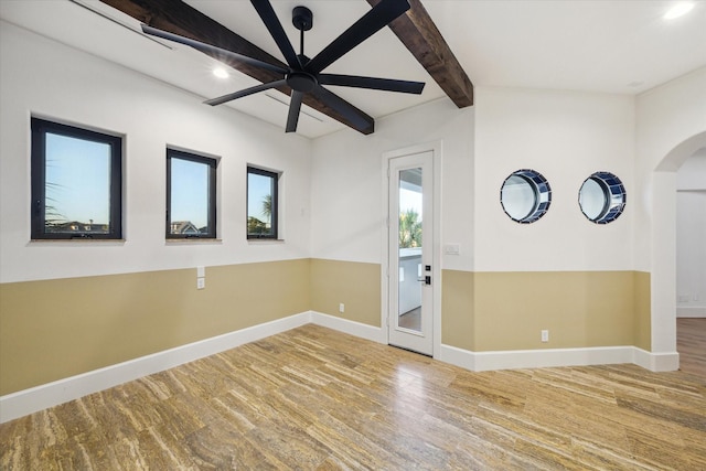 721 Harborside Way, League City, TX 77565 - spare room with baseboards, a ceiling fan, arched walkways, recessed lighting, and beam ceiling