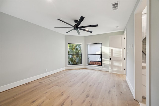 721 Harborside Way, League City, TX 77565 - spare room featuring baseboards, light wood-style floors, and a ceiling fan