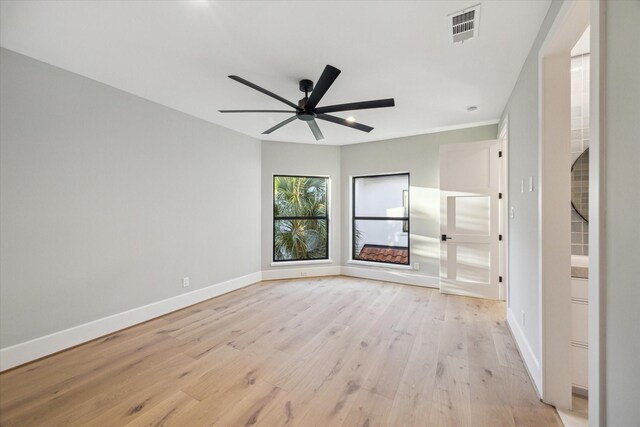 721 Harborside Way, League City, TX 77565 - spare room featuring baseboards, light wood-style flooring, and ceiling fan