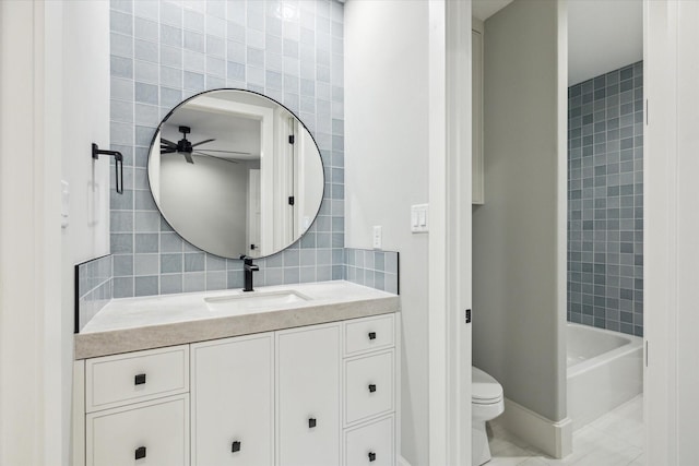 721 Harborside Way, League City, TX 77565 - full bathroom with tile walls, a ceiling fan, vanity, toilet, and tile patterned flooring