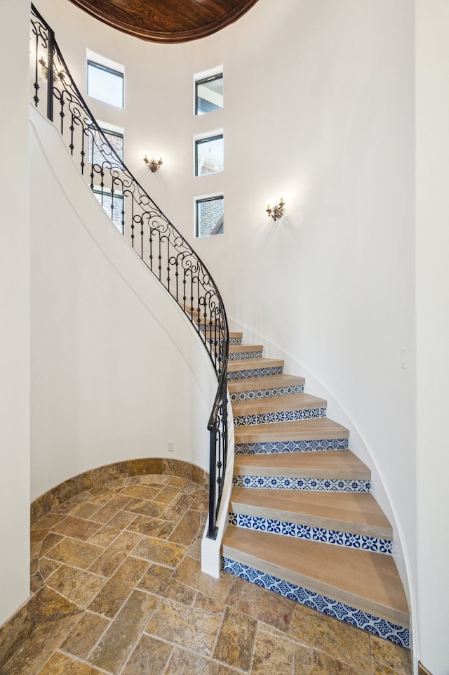 721 Harborside Way, League City, TX 77565 - stairs with a high ceiling and stone tile flooring