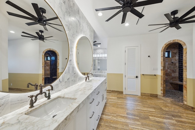 721 Harborside Way, League City, TX 77565 - full bath featuring double vanity, wood finished floors, recessed lighting, tiled shower, and baseboards