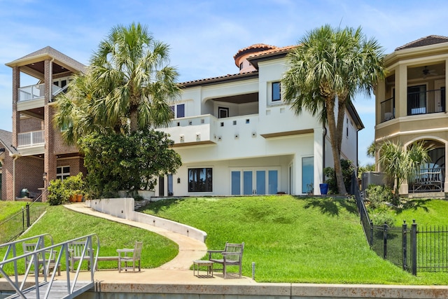 721 Harborside Way, League City, TX 77565 - rear view of house with stucco siding and a balcony