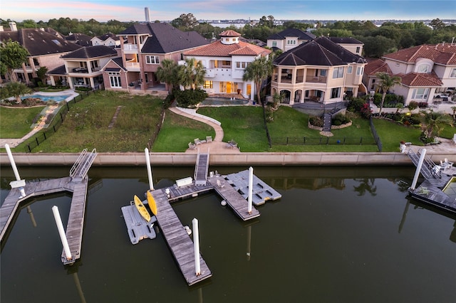 721 Harborside Way, League City, TX 77565 - dock with a balcony, a residential view, a water view, and a patio