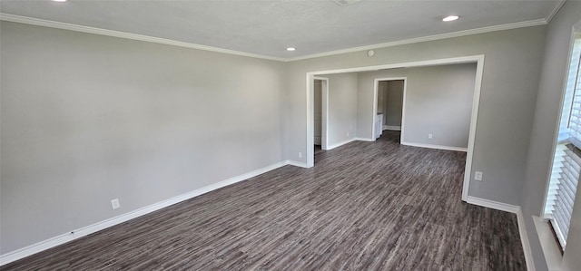 215 San Jacinto St, Highlands, TX 77562 - spare room with baseboards, dark wood-style flooring, recessed lighting, crown molding, and plenty of natural light