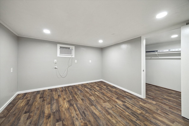 1309 Centennial Dr, Houston, TX 77055 - finished basement with a wall unit AC, recessed lighting, wood finished floors, baseboards, and ornamental molding
