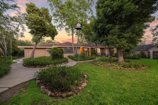 1309 Centennial Dr, Houston, TX 77055 - ranch-style house with a lawn