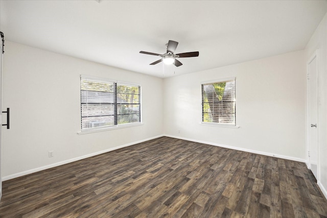 1309 Centennial Dr, Houston, TX 77055 - empty room with dark wood finished floors, ceiling fan, and baseboards