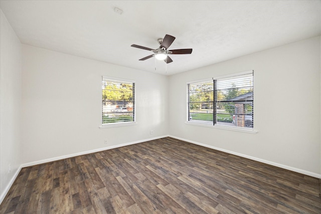 1309 Centennial Dr, Houston, TX 77055 - spare room featuring plenty of natural light, dark wood-style floors, baseboards, and ceiling fan