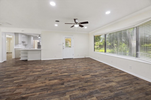 1309 Centennial Dr, Houston, TX 77055 - unfurnished living room with ceiling fan, baseboards, ornamental molding, recessed lighting, and dark wood finished floors