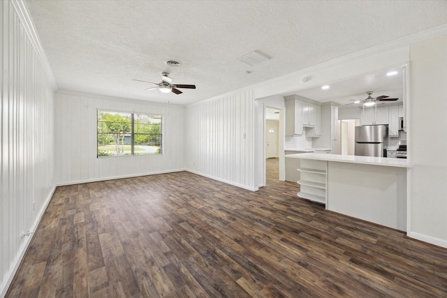 1309 Centennial Dr, Houston, TX 77055 - unfurnished living room featuring crown molding, ceiling fan, a textured ceiling, dark wood-style flooring, and baseboards