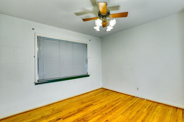 10134 Brinwood Dr, Houston, TX 77043 - spare room featuring ceiling fan, wood finished floors, and baseboards