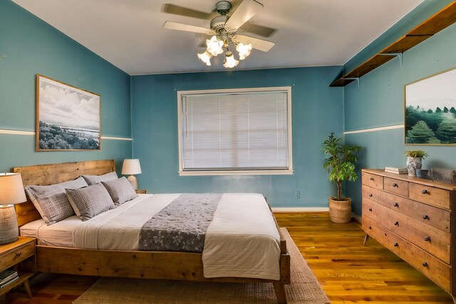 10134 Brinwood Dr, Houston, TX 77043 - bedroom with wood finished floors and a ceiling fan