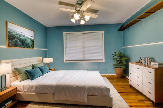 10134 Brinwood Dr, Houston, TX 77043 - bedroom with wood finished floors and ceiling fan