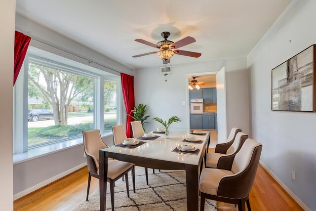 10134 Brinwood Dr, Houston, TX 77043 - dining area featuring ceiling fan, light wood-style flooring, and baseboards