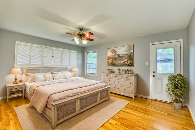 10134 Brinwood Dr, Houston, TX 77043 - bedroom with light wood-style floors, baseboards, and a ceiling fan