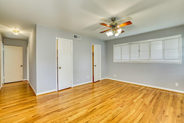 10134 Brinwood Dr, Houston, TX 77043 - unfurnished bedroom featuring baseboards, light wood finished floors, and a ceiling fan