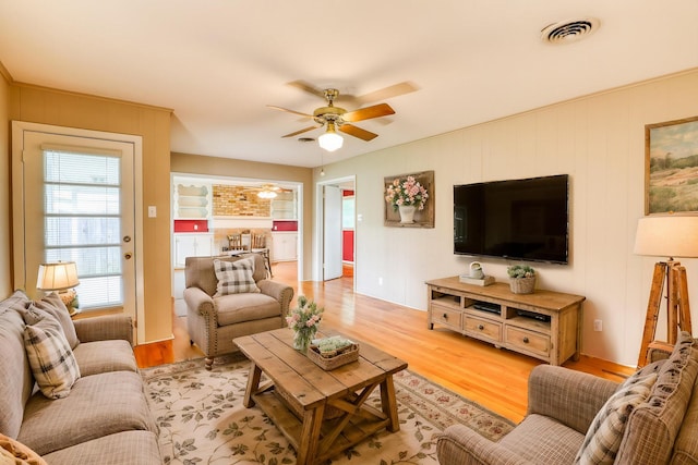 10134 Brinwood Dr, Houston, TX 77043 - living area featuring a ceiling fan and light wood-type flooring