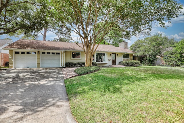 10134 Brinwood Dr, Houston, TX 77043 - ranch-style house featuring a chimney, an attached garage, and driveway
