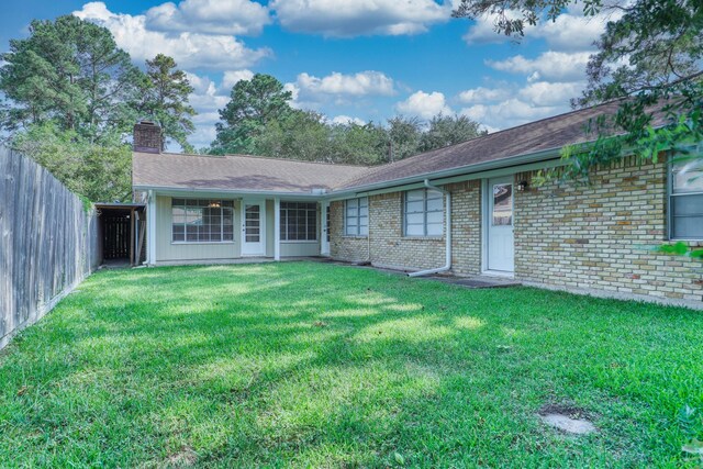 10134 Brinwood Dr, Houston, TX 77043 - rear view of property with a chimney and brick siding