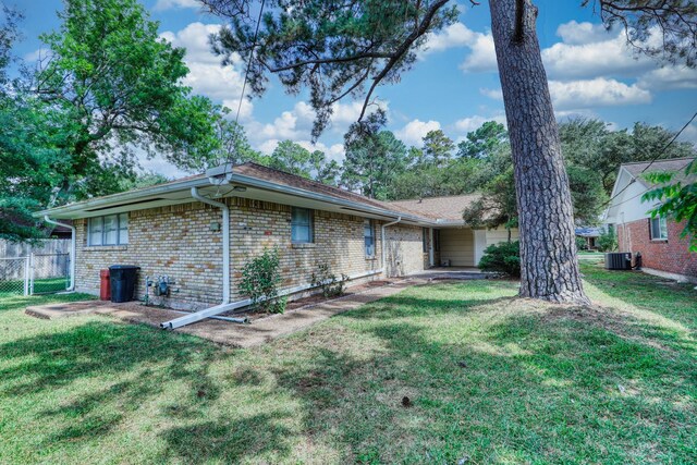 10134 Brinwood Dr, Houston, TX 77043 - back of property with brick siding and central air condition unit