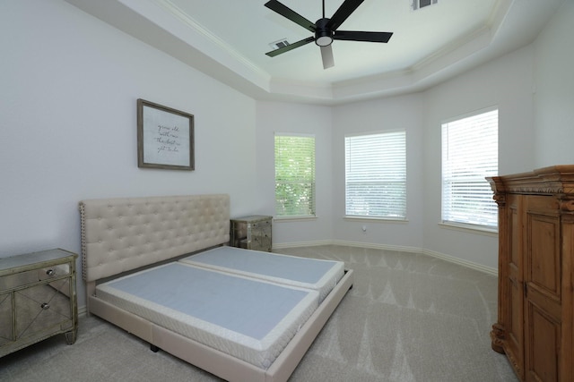 6 Lovenote Ct, The Woodlands, TX 77382 - bedroom featuring carpet, multiple windows, ornamental molding, a tray ceiling, and baseboards