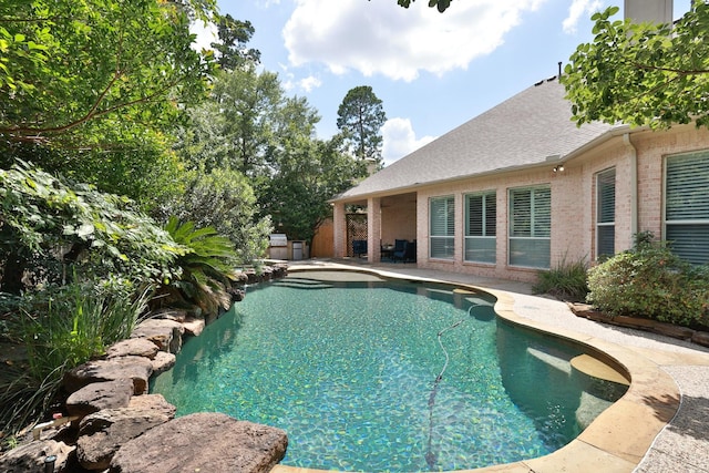 6 Lovenote Ct, The Woodlands, TX 77382 - outdoor pool with a patio area