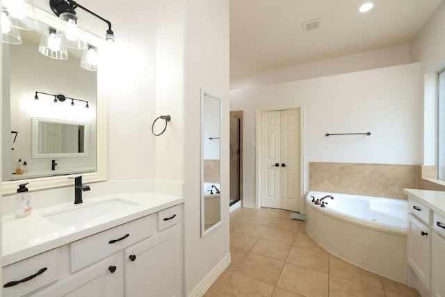 6 Lovenote Ct, The Woodlands, TX 77382 - full bathroom featuring vanity, tile patterned floors, a whirlpool tub, and a shower stall