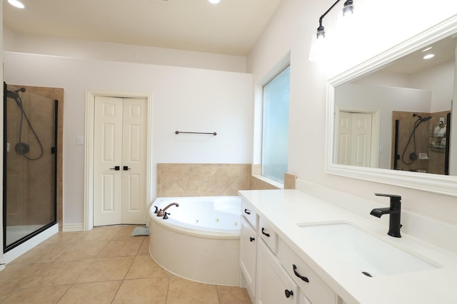 6 Lovenote Ct, The Woodlands, TX 77382 - bathroom with a stall shower, vanity, a jetted tub, tile patterned flooring, and recessed lighting