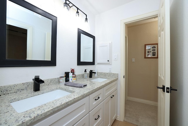 6 Lovenote Ct, The Woodlands, TX 77382 - full bathroom with double vanity and baseboards