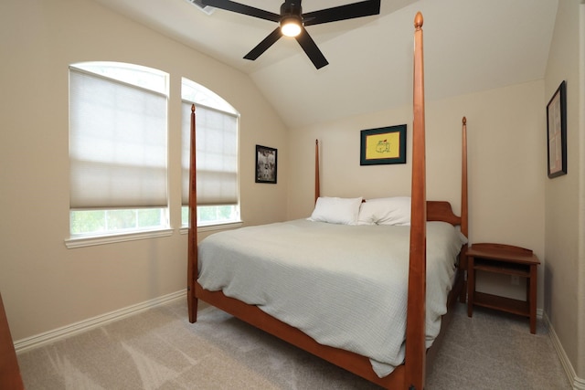 6 Lovenote Ct, The Woodlands, TX 77382 - bedroom with lofted ceiling, carpet, baseboards, and a ceiling fan