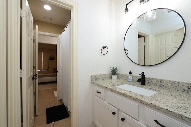 6 Lovenote Ct, The Woodlands, TX 77382 - bathroom with tile patterned floors and vanity